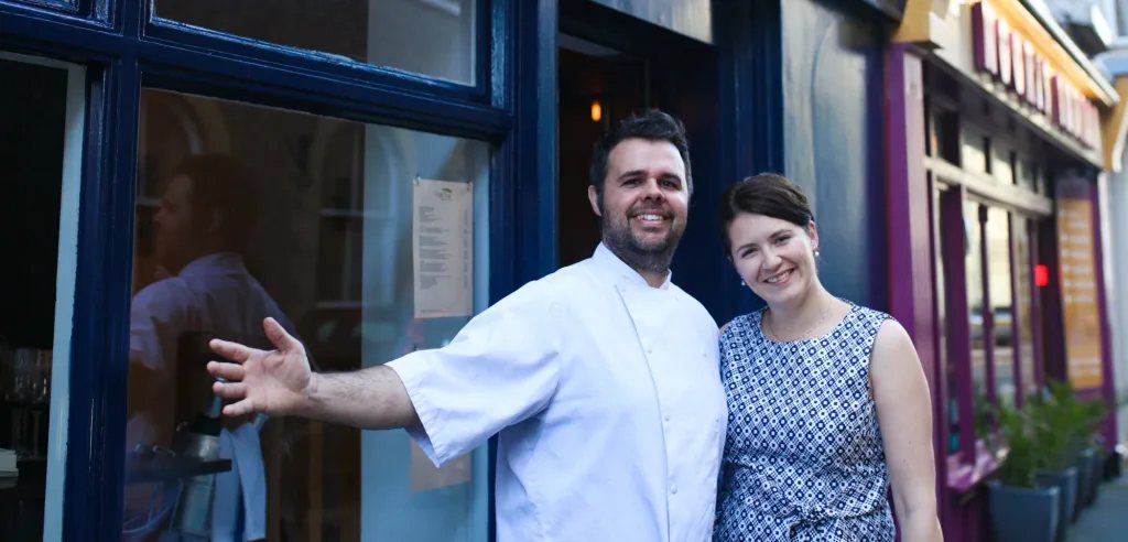 David and Ivana Roy welcoming guests outside the restaurant